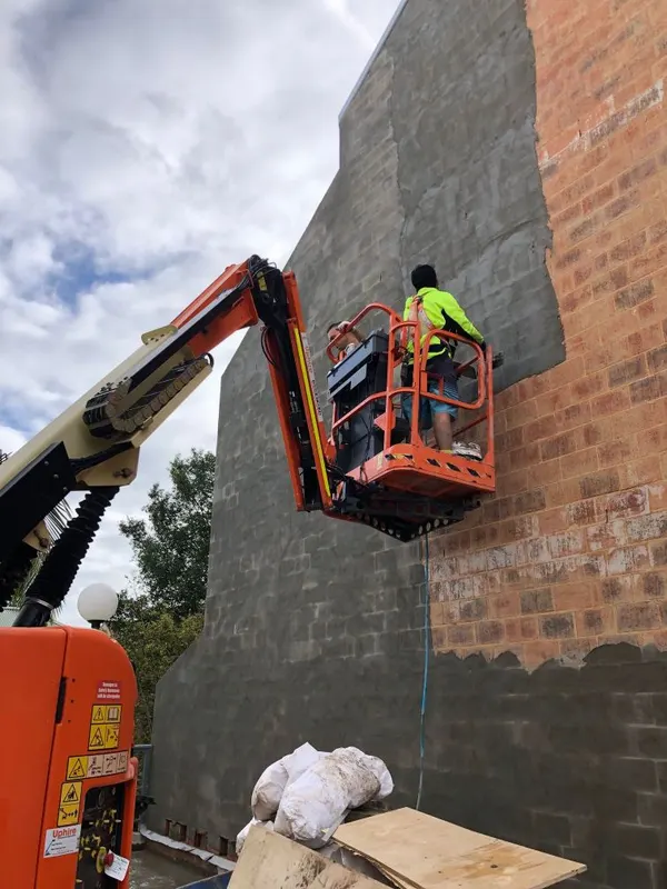 Facade rendering from a boom lift, Leichhardt apartment building